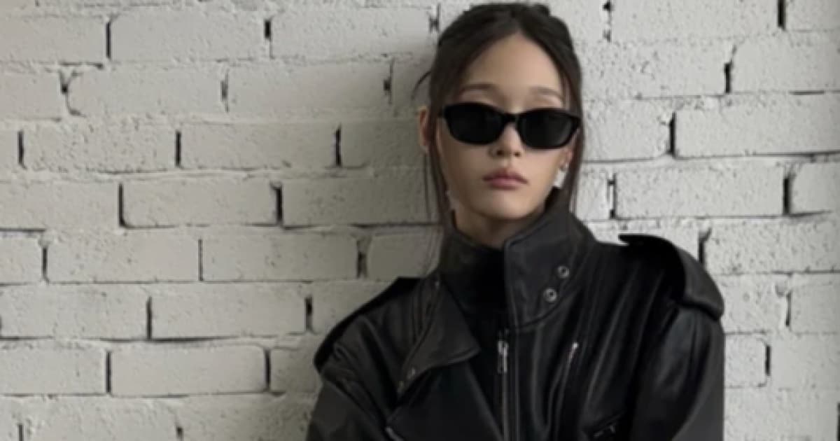 ALLDAY PROJECT's Ani Captivates with Sleek Black Styling and Mature Charisma