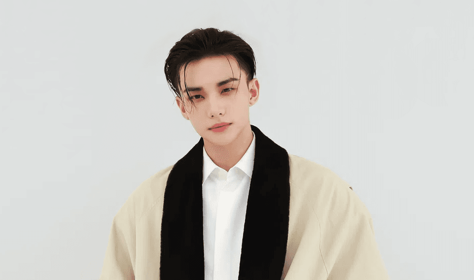 Stray Kids' Hyunjin attends Dior's Spring/Summer 2027 show at Paris Fashion Week in a classic black tuxedo jumper look