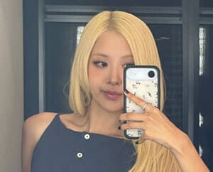 ROSÉ Stuns with Effortless Styling in Navy Top and Signature Blonde Hair